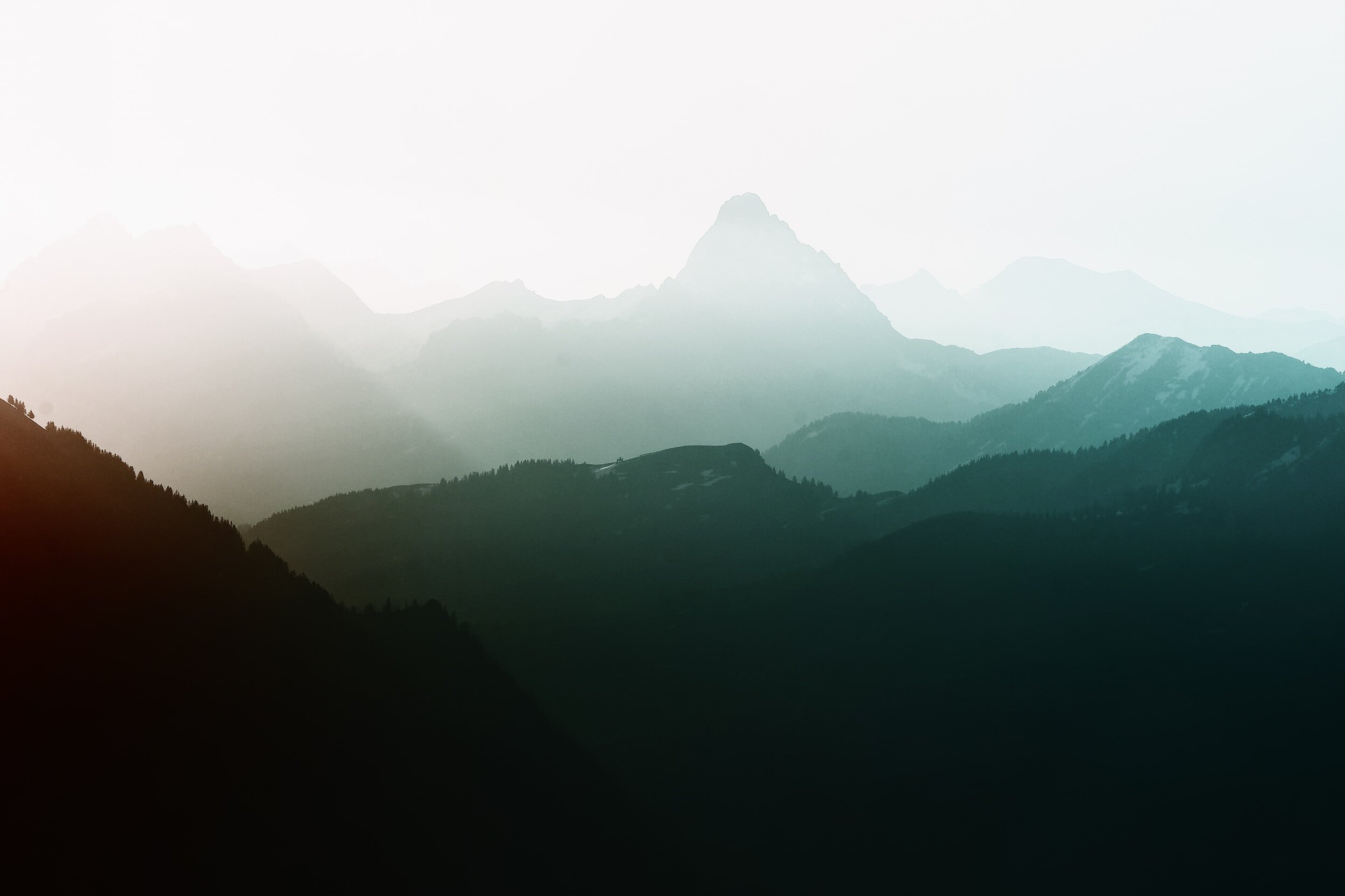 misty mountains to illustrate the mental peace you can experience with trauma journal prompts and writing exercises