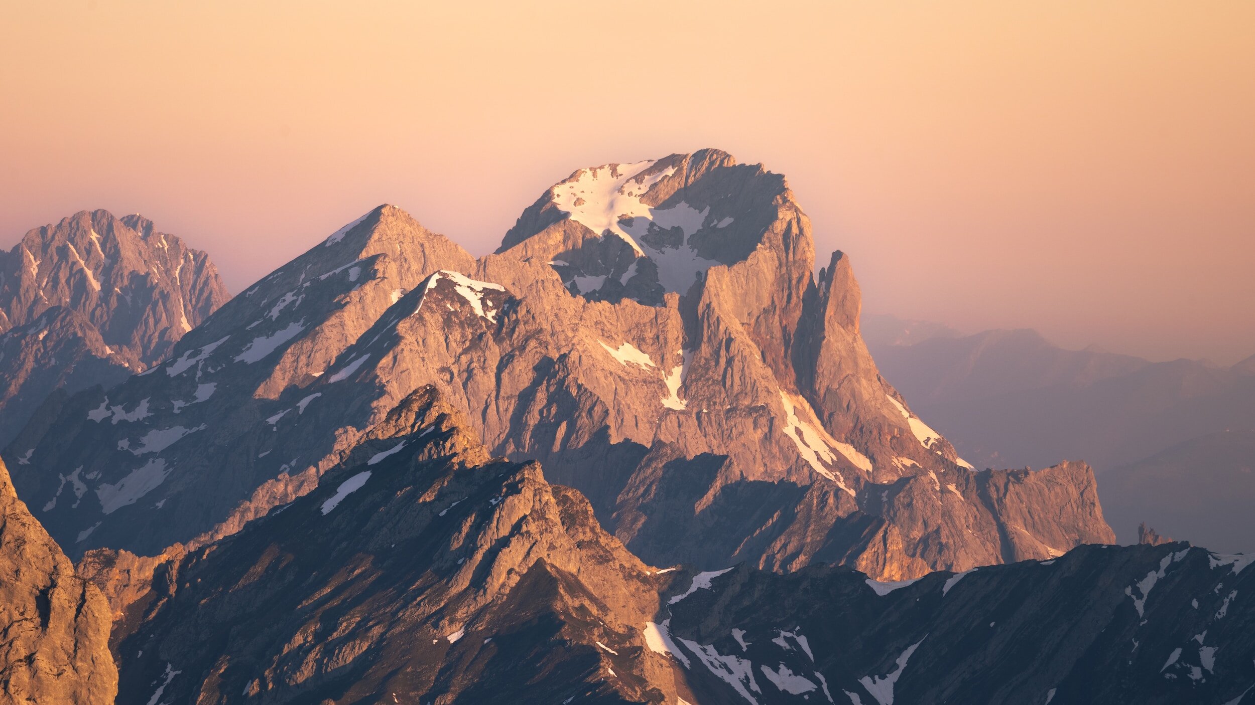sharp mountains and cliffs to illustrate the process of building strength in the face of trauma
