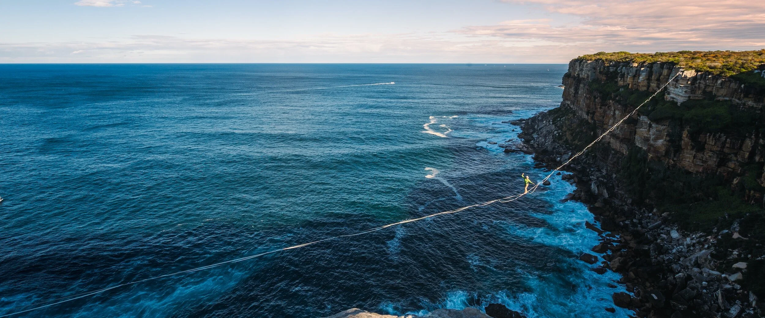 Blue ocean with cliffs overlooking