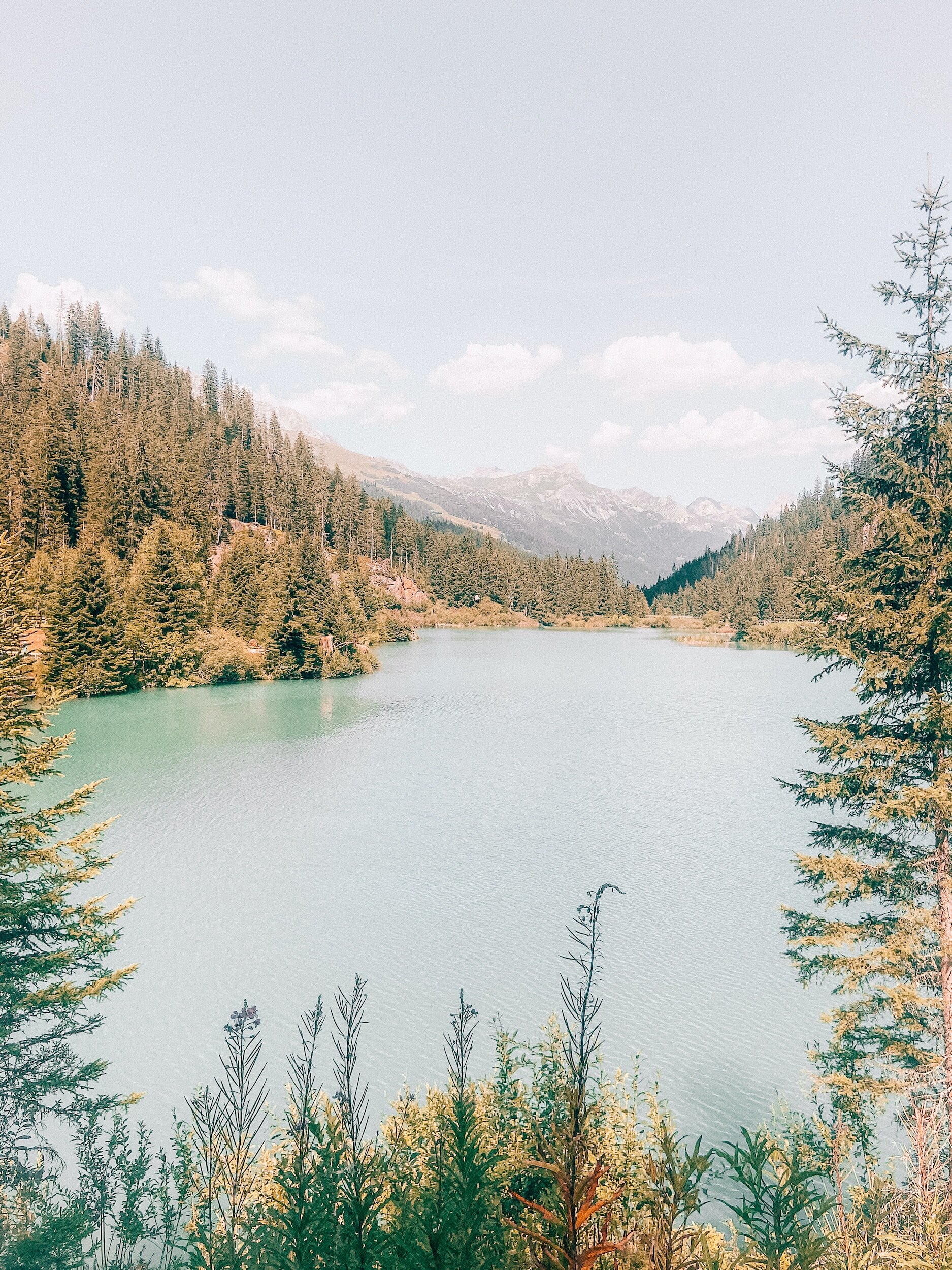 understanding Big T versus little t trauma with an alpine lake and mountains in the background