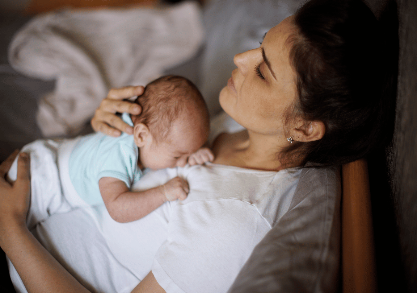 a therapists guide for healing from birth trauma illustrated by a woman holding her newborn
