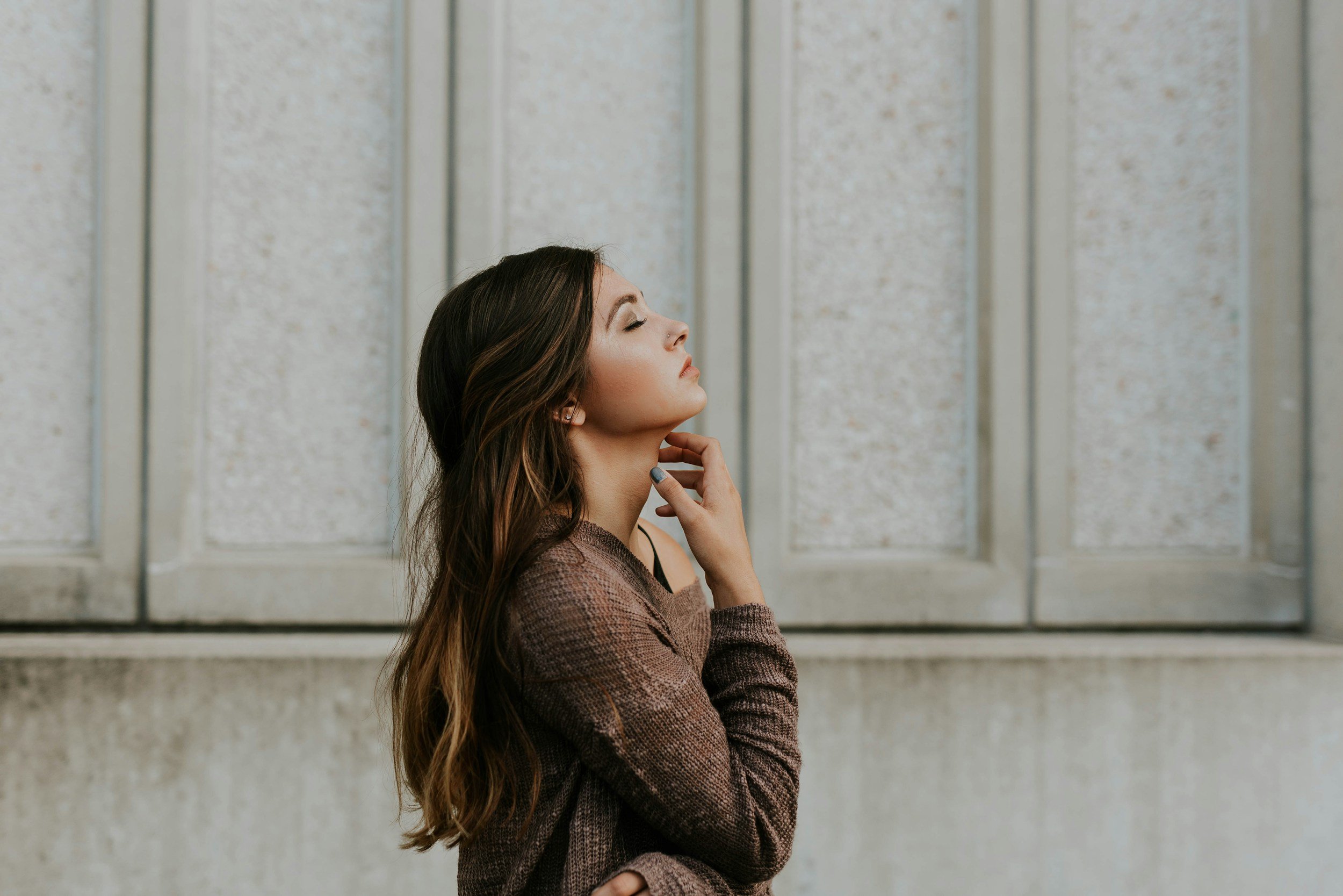 childhood trauma in adults illustrated by a woman looking up and anxious