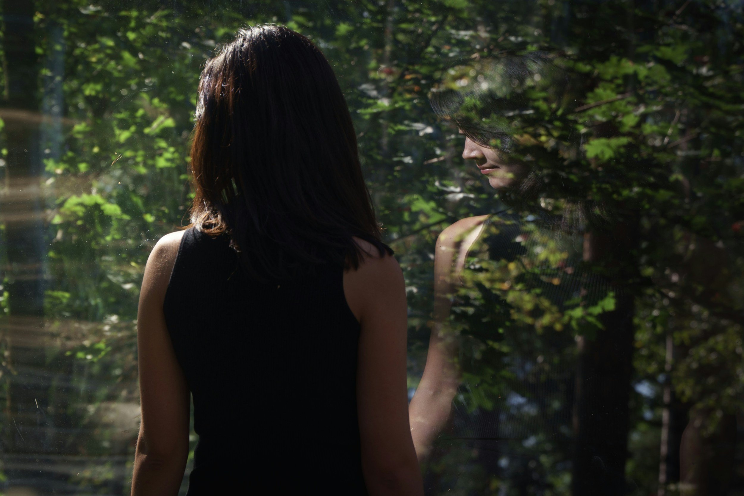 the connection between people pleasing and anxiety a woman walking through a garden